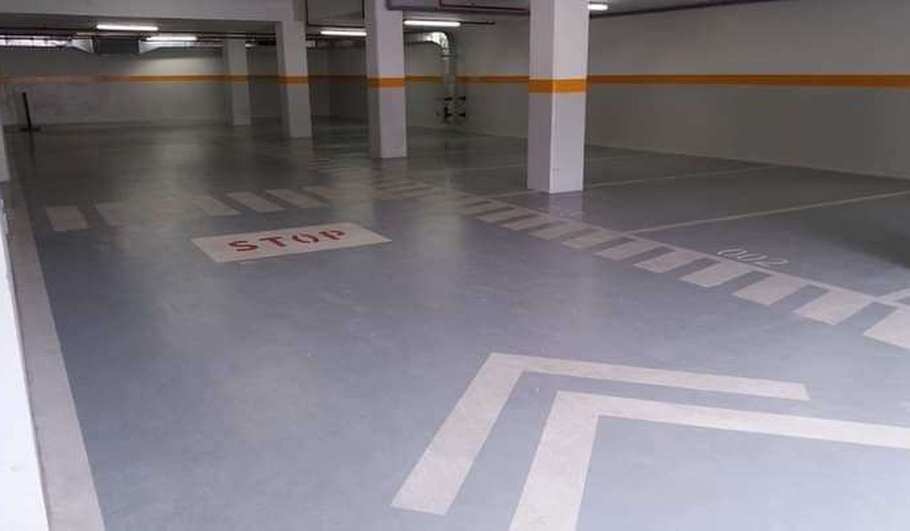 Finished parking deck with epoxy coating and line marking