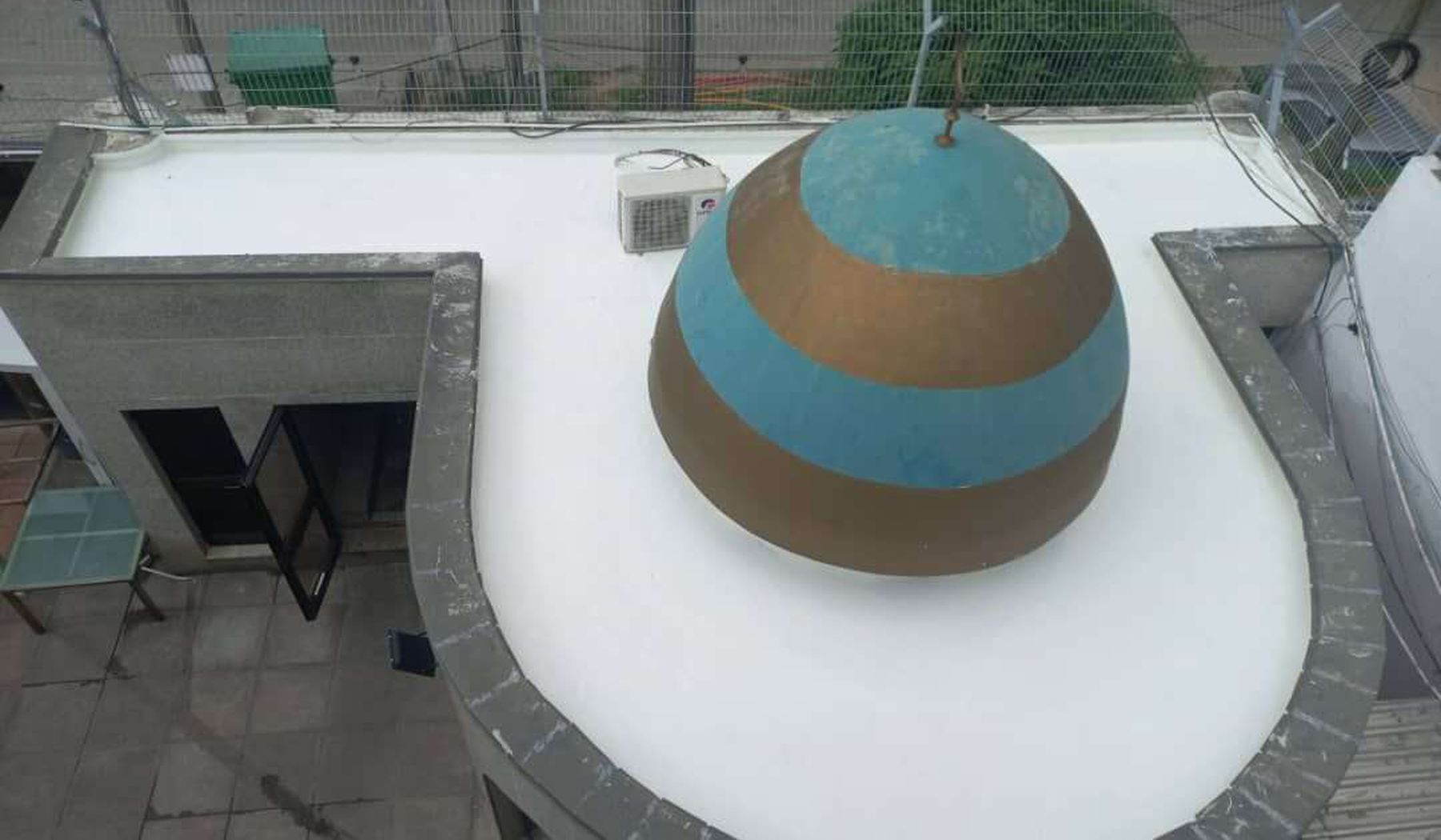 Waterproofed rooftop pool deck and water feature